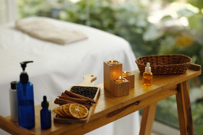 Relaxing Spa Setting with Lit Candles and Aromatherapy Oils
